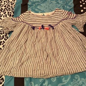 Cute striped blouse with a few Pom poms